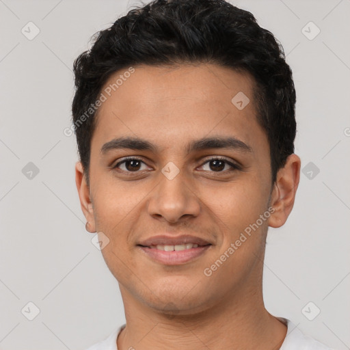 Joyful latino young-adult male with short  black hair and brown eyes