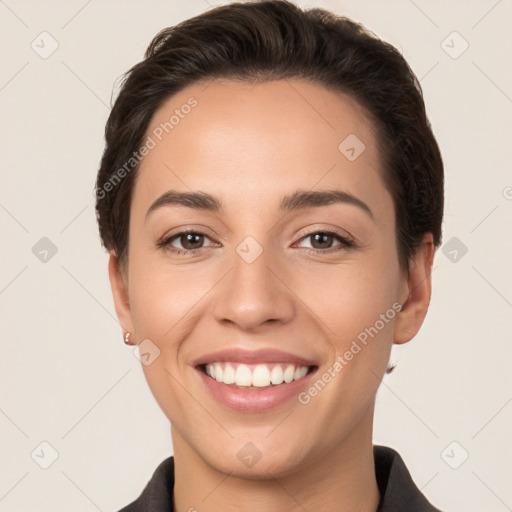 Joyful white young-adult female with short  brown hair and brown eyes