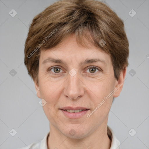 Joyful white adult female with short  brown hair and grey eyes