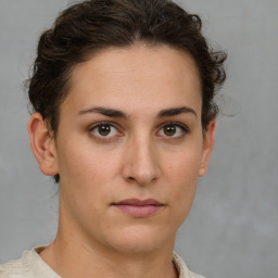 Neutral white young-adult female with short  brown hair and brown eyes