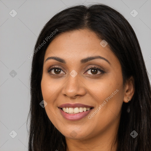 Joyful latino young-adult female with long  brown hair and brown eyes