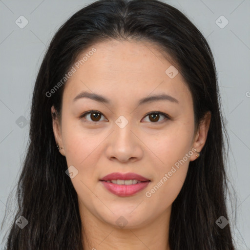 Joyful asian young-adult female with long  brown hair and brown eyes