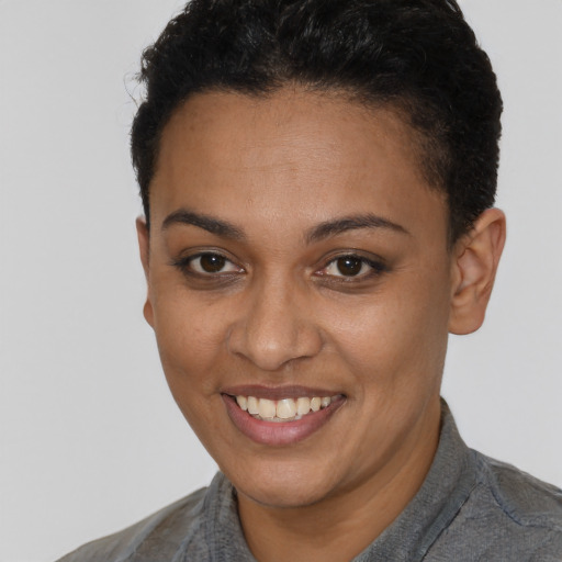 Joyful latino young-adult female with short  brown hair and brown eyes
