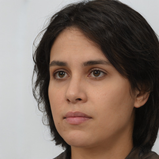 Neutral white young-adult female with long  brown hair and brown eyes