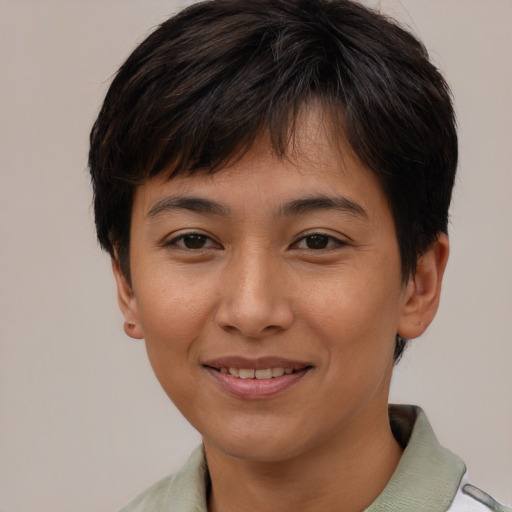 Joyful asian young-adult female with short  brown hair and brown eyes