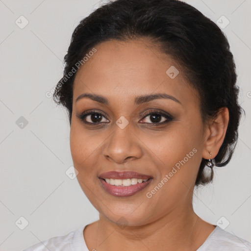 Joyful latino young-adult female with medium  brown hair and brown eyes