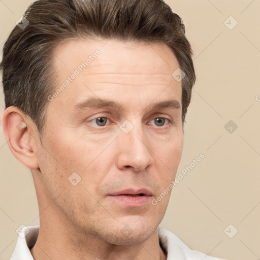 Neutral white adult male with short  brown hair and brown eyes