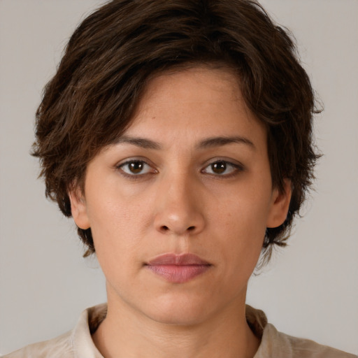 Neutral white young-adult female with short  brown hair and brown eyes