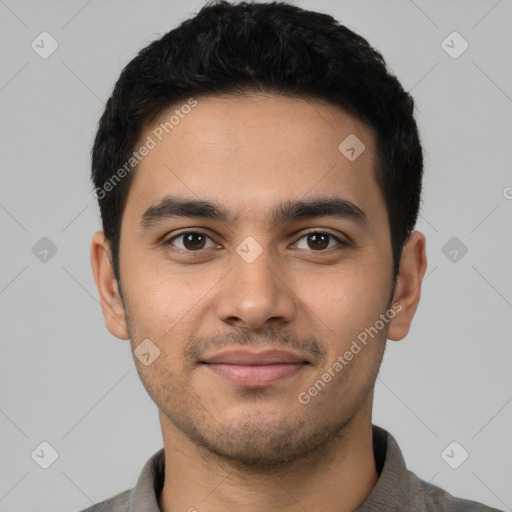 Joyful latino young-adult male with short  black hair and brown eyes