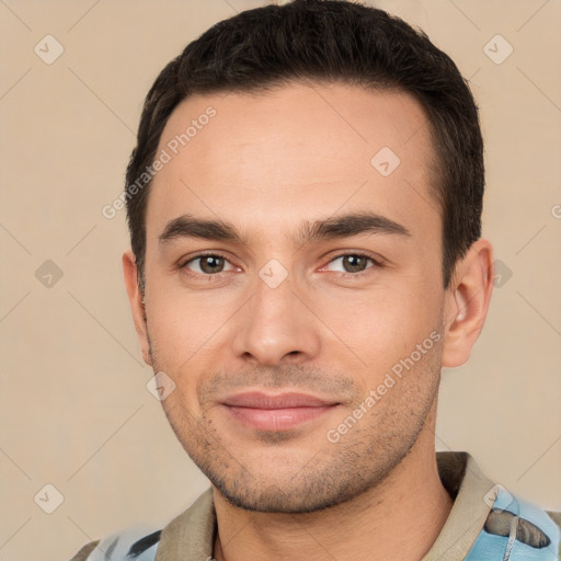 Joyful white young-adult male with short  brown hair and brown eyes