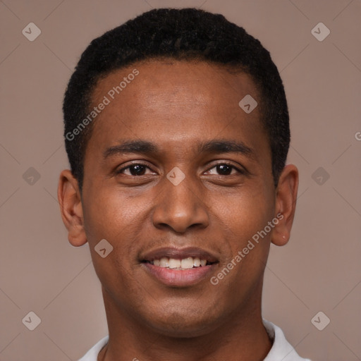 Joyful black young-adult male with short  brown hair and brown eyes