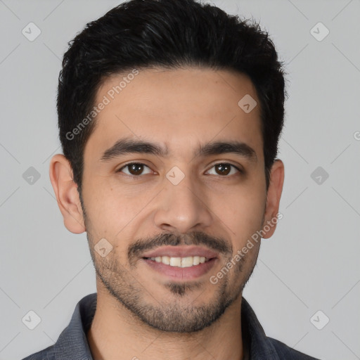 Joyful latino young-adult male with short  black hair and brown eyes