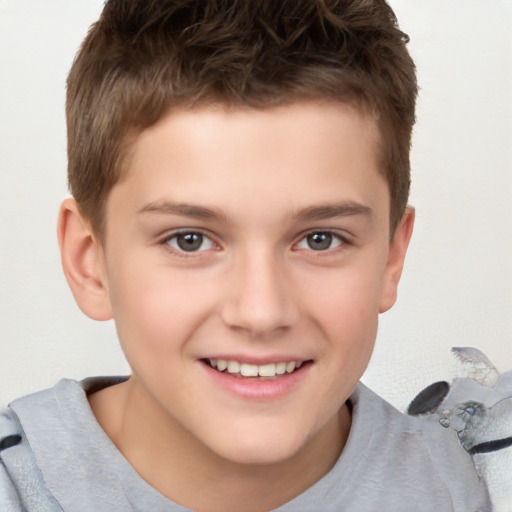 Joyful white child male with short  brown hair and brown eyes