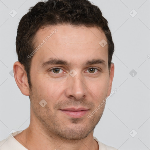 Joyful white young-adult male with short  brown hair and brown eyes