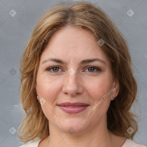 Joyful white adult female with medium  brown hair and brown eyes