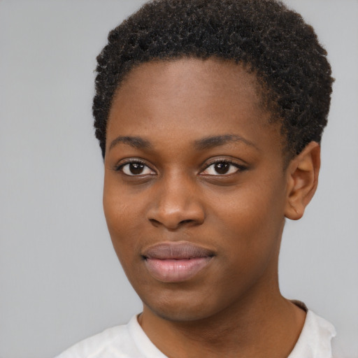 Joyful black young-adult female with short  black hair and brown eyes
