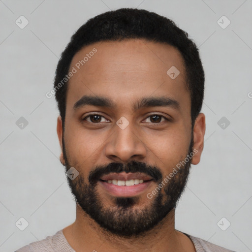 Joyful latino young-adult male with short  black hair and brown eyes