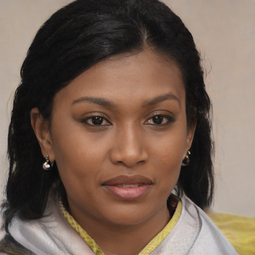 Joyful black young-adult female with medium  brown hair and brown eyes