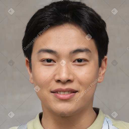 Joyful asian young-adult male with short  black hair and brown eyes