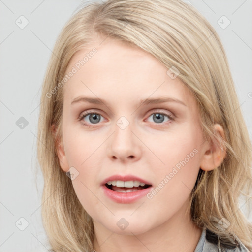 Joyful white young-adult female with medium  brown hair and blue eyes