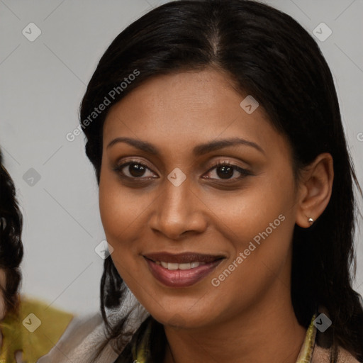 Joyful black young-adult female with medium  brown hair and brown eyes