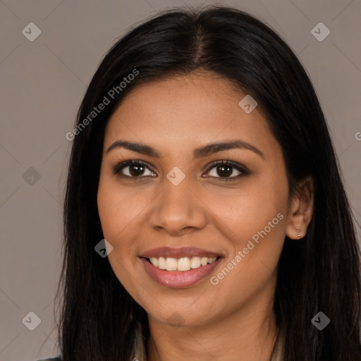 Joyful latino young-adult female with long  black hair and brown eyes