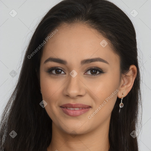 Joyful latino young-adult female with long  brown hair and brown eyes