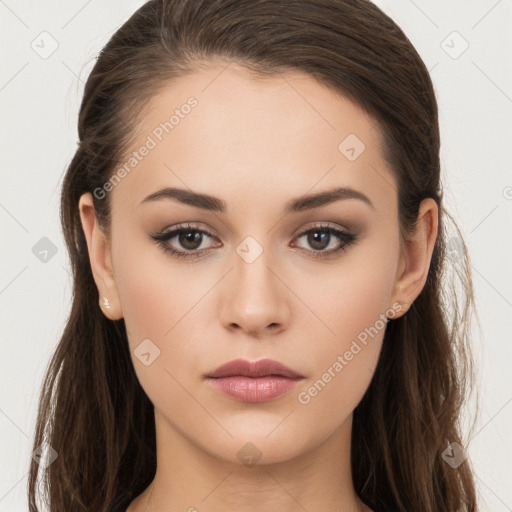 Neutral white young-adult female with long  brown hair and brown eyes