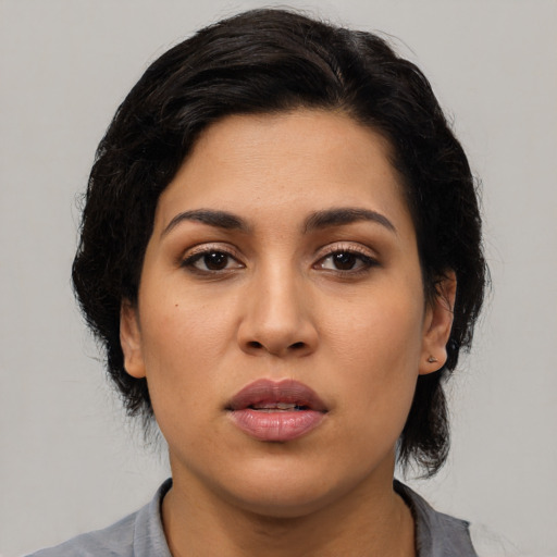 Neutral latino young-adult female with medium  black hair and brown eyes