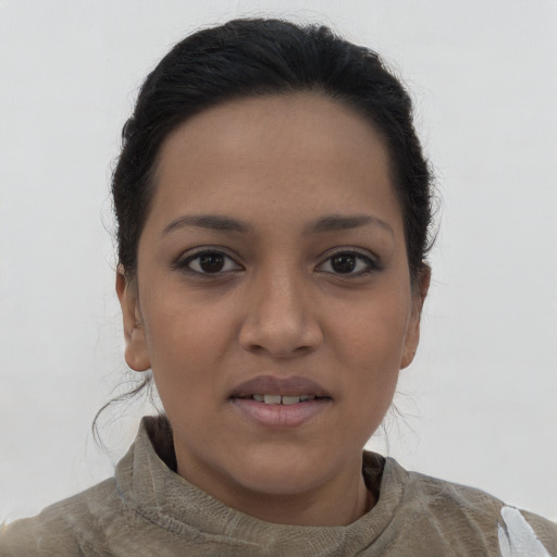 Joyful latino young-adult female with short  brown hair and brown eyes