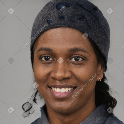 Joyful black young-adult female with short  black hair and brown eyes