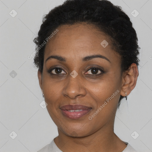 Joyful black young-adult female with short  brown hair and brown eyes