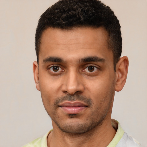 Neutral black young-adult male with short  black hair and brown eyes
