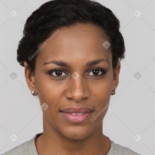 Joyful black young-adult female with short  black hair and brown eyes