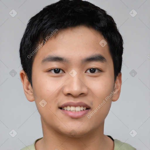 Joyful asian young-adult male with short  black hair and brown eyes