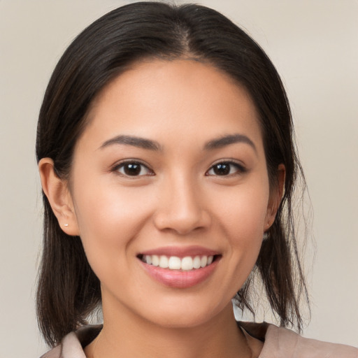 Joyful white young-adult female with medium  brown hair and brown eyes