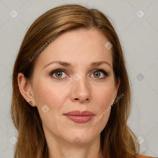 Joyful white adult female with long  brown hair and brown eyes