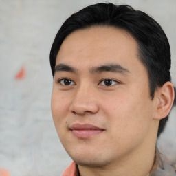 Joyful asian young-adult male with short  black hair and brown eyes