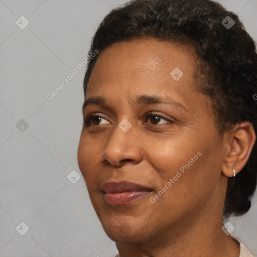 Joyful black adult female with short  brown hair and brown eyes