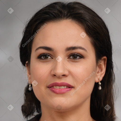 Joyful white adult female with medium  brown hair and brown eyes