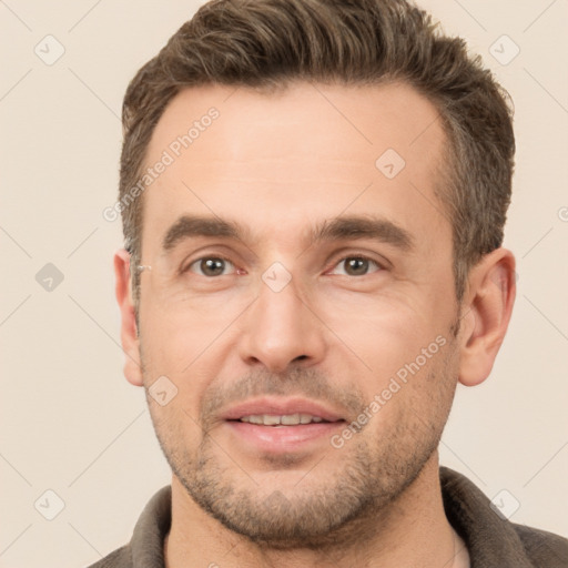 Joyful white adult male with short  brown hair and brown eyes