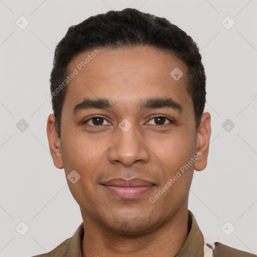 Joyful latino young-adult male with short  black hair and brown eyes