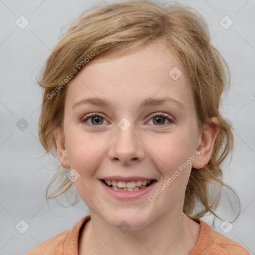 Joyful white child female with medium  brown hair and blue eyes