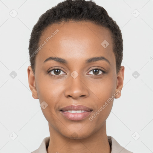 Joyful black young-adult female with short  brown hair and brown eyes