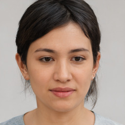 Joyful asian young-adult female with medium  brown hair and brown eyes