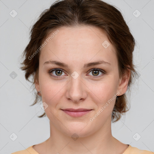 Joyful white young-adult female with medium  brown hair and green eyes