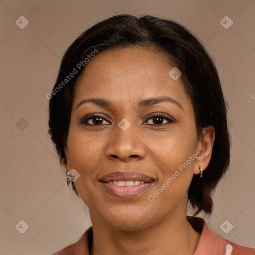 Joyful latino adult female with medium  brown hair and brown eyes