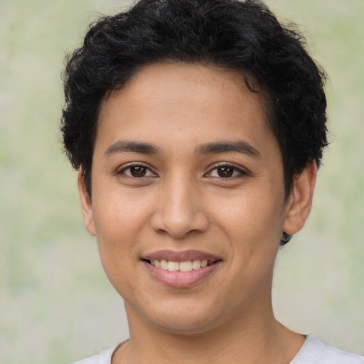 Joyful latino young-adult female with short  brown hair and brown eyes