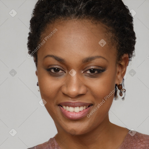 Joyful black young-adult female with short  brown hair and brown eyes