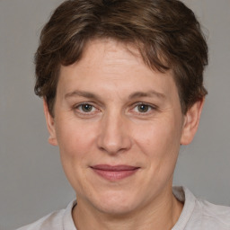 Joyful white adult female with short  brown hair and brown eyes